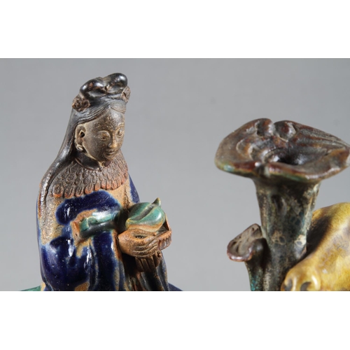 92 - A Chinese porcelain incense stand, modelled as Kuan Yin on a camel, on rockwork base, 12 1/4