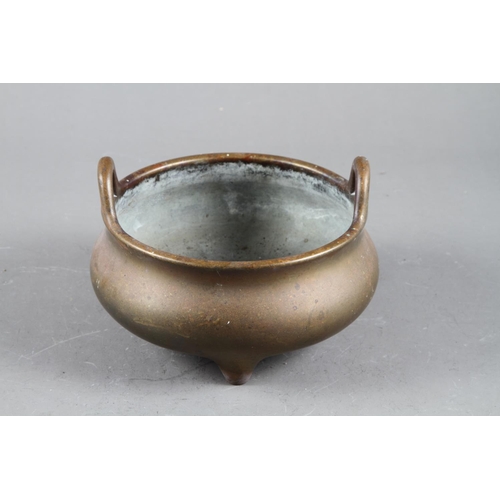 94 - A Chinese bronze censer on three legs, seal mark, 6” dia 1474g