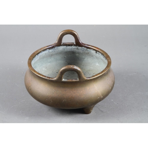 94 - A Chinese bronze censer on three legs, seal mark, 6” dia 1474g