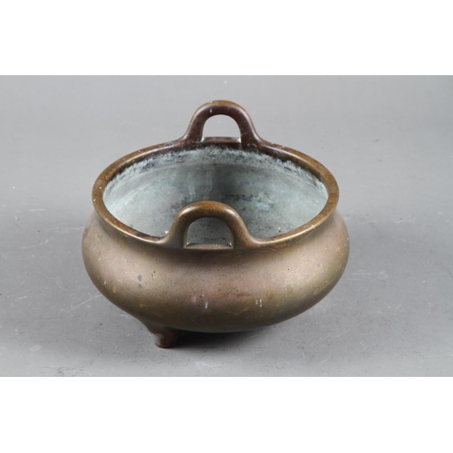 94 - A Chinese bronze censer on three legs, seal mark, 6” dia 1474g