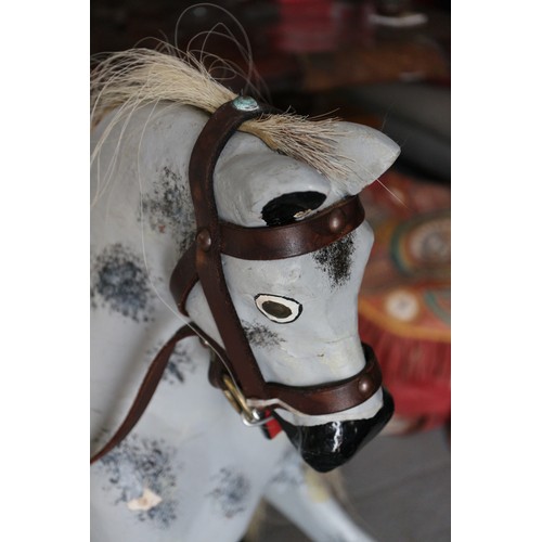 150 - A painted wooden rocking horse, 24” longFloor to ear: 34