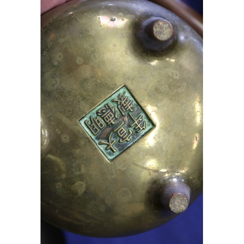 94 - A Chinese bronze censer on three legs, seal mark, 6” dia 1474g