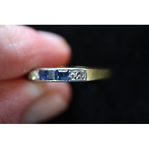 278 - An 18 carat sapphire and diamond half eternity ring, size Q