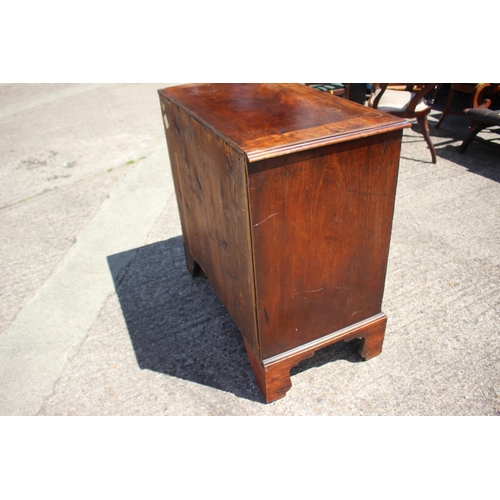 442 - An early Georgian Cuban mahogany chest of four long graduated drawers with gilt brass handles (one m... 