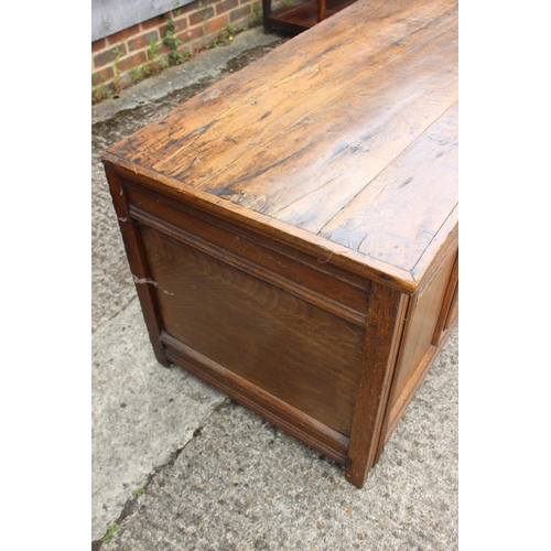 445 - A 18th century four panel front coffer with plank top, on moulded stile supports, 60