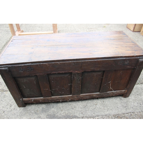 445 - A 18th century four panel front coffer with plank top, on moulded stile supports, 60