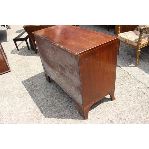 451 - An early 19th century mahogany chest of two short and two long drawers with stamped brass handles, o... 