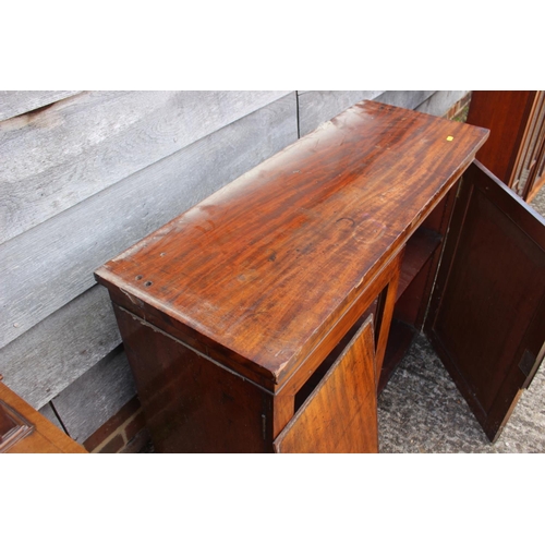 457 - A Victorian mahogany bookcase, the upper section enclosed glazed panelled doors over cupboards, 38” ... 