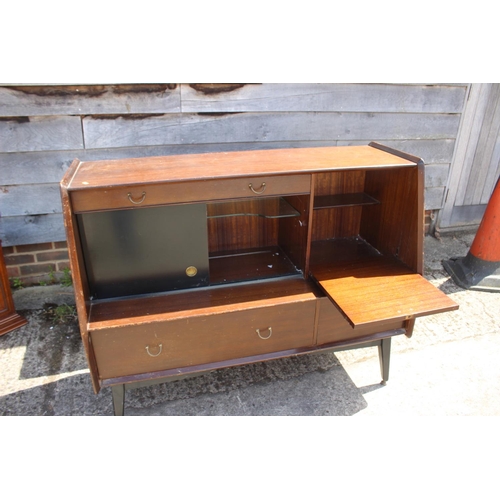 501 - A 1960s G Plan Librenza type mahogany sideboard, fitted one drawer, sliding doors and drop front coc... 