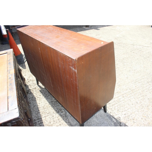 501 - A 1960s G Plan Librenza type mahogany sideboard, fitted one drawer, sliding doors and drop front coc... 