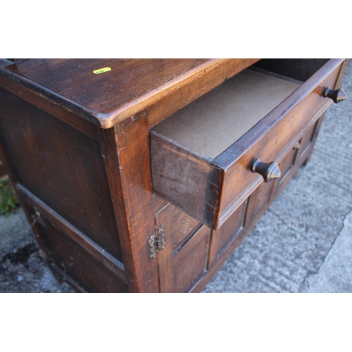 517 - An oak court cupboard of 17th century design, fitted cupboard over two drawers and two panelled door... 