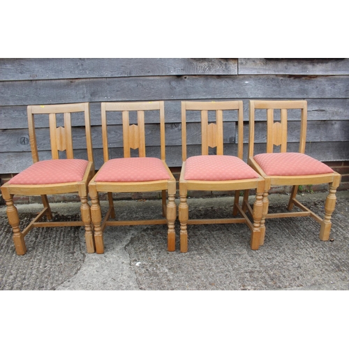 552 - A carved oak framed refectory dining table, on four fluted columns and splay support, 74