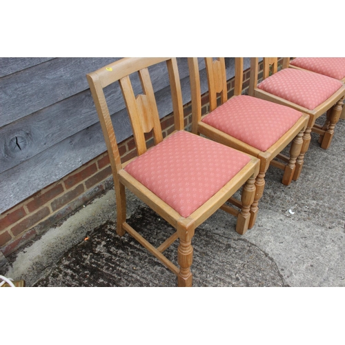 552 - A carved oak framed refectory dining table, on four fluted columns and splay support, 74