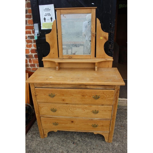 611 - A pine dressing table with mirror over three long drawers, 38” wide x 17” deep x 59” high