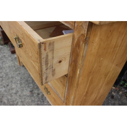 611 - A pine dressing table with mirror over three long drawers, 38” wide x 17” deep x 59” high