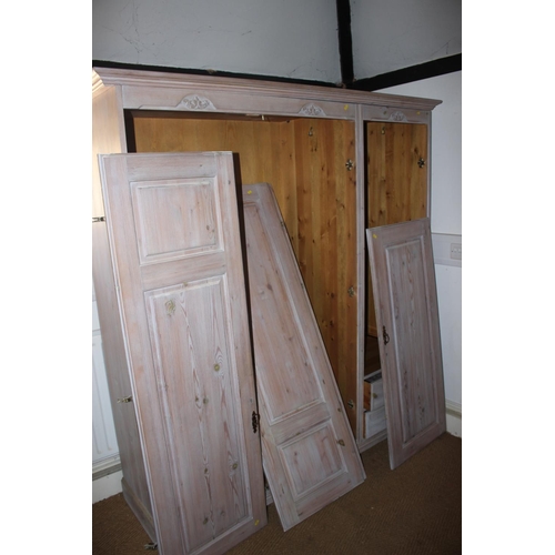 608 - A Jaycee Victorian Collection limed pine combination wardrobe enclosed three doors and fitted two dr... 