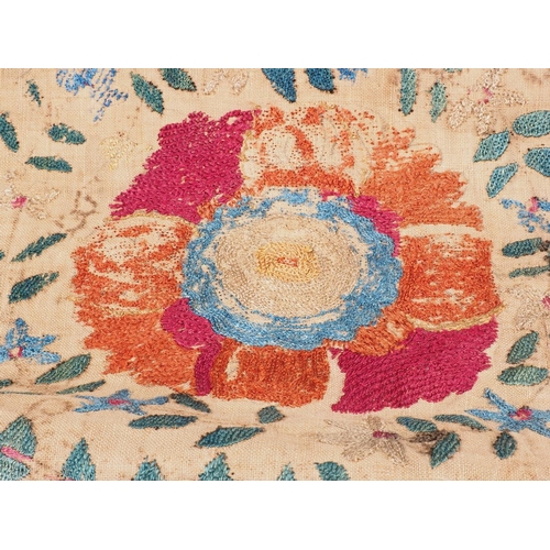 127 - A 19th century embroidered panel with floral designs, 57 1/2” x 38 1/2”