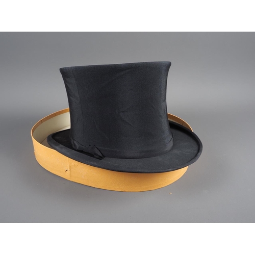 128 - An Austin Reed Ltd collapsible top hat, a collar box and a number of collars