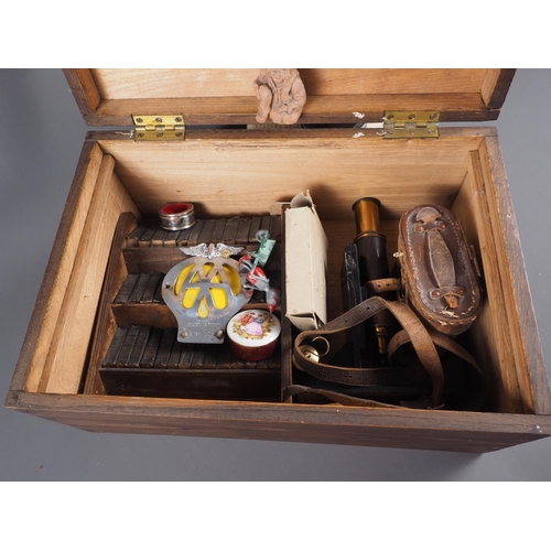 136 - An assortment of items, including binoculars, two AA badges, a miniature model miner's lamps, a set ... 