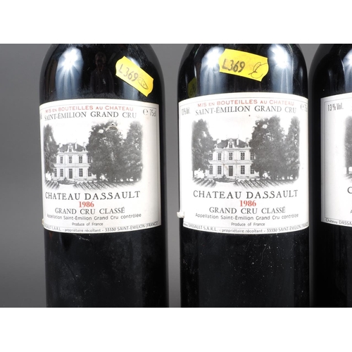 154 - Four bottles of 1986 Saint-Emilion Grand Cru Chateau Dassault Grand Cru Classe