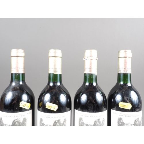 154 - Four bottles of 1986 Saint-Emilion Grand Cru Chateau Dassault Grand Cru Classe