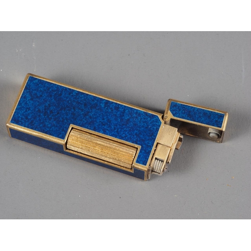 192 - A Dunhill dark blue and gilt metal lighter, a red leather Dunhill wallet and a black and gilt metal ... 