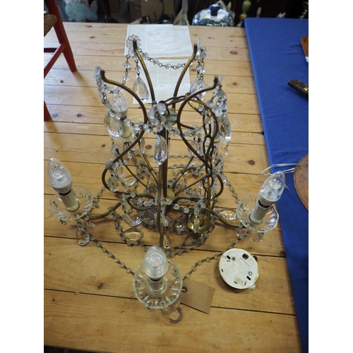 216 - A brass five-light ceiling pendant with cut glass drops