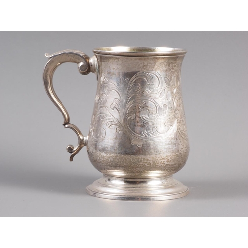 262 - A Georgian silver pint tankard with later chased decoration, William Cripps, London 1775, 5” high, 1... 