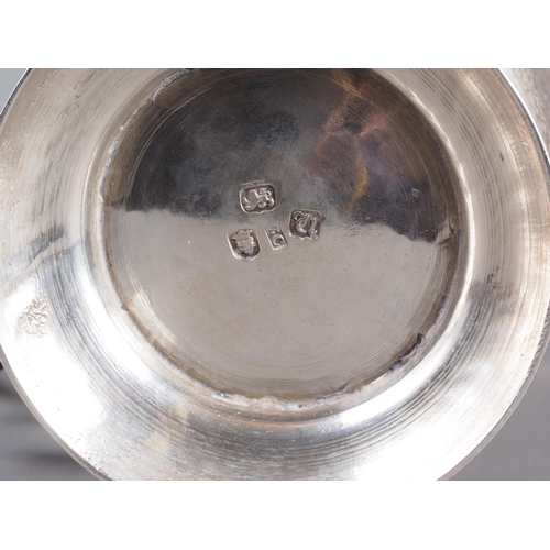 262 - A Georgian silver pint tankard with later chased decoration, William Cripps, London 1775, 5” high, 1... 