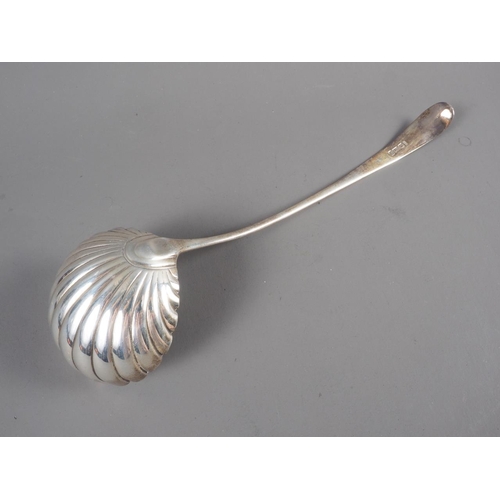 277 - A Georgian silver punch ladle with scallop shell bowl, 4.5oz troy approx