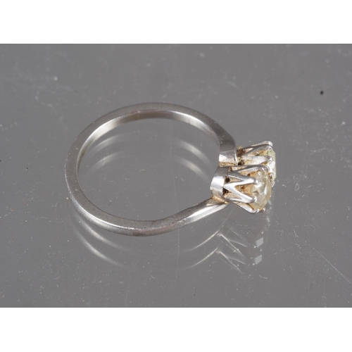 290 - A platinum and diamond crossover ring, size P, 4.8g