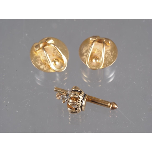 297 - A pair of 9ct yellow and white gold ear clips, 2.4g, and a yellow metal shirt stud