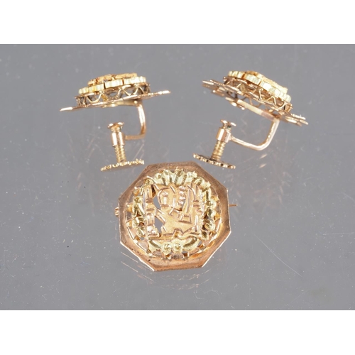 298 - A 1960s yellow and rose gold Aztec design brooch and a pair of matching earrings, stamped 18ct, 21g