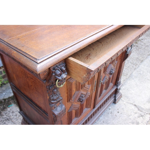 459 - An oak side cupboard of 17th century design, fitted one drawer over two panelled doors with lion mas... 