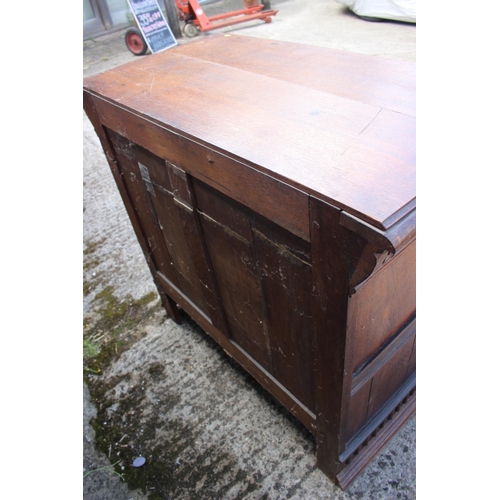 459 - An oak side cupboard of 17th century design, fitted one drawer over two panelled doors with lion mas... 