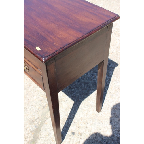 462 - An early 19th century mahogany side table, fitted two smaller and one long drawer with gilt brass ha... 