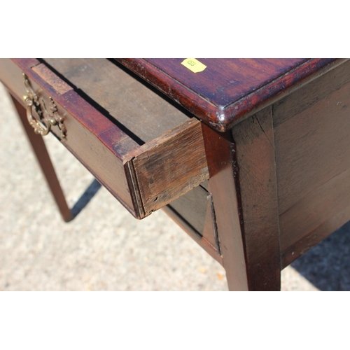 462 - An early 19th century mahogany side table, fitted two smaller and one long drawer with gilt brass ha... 