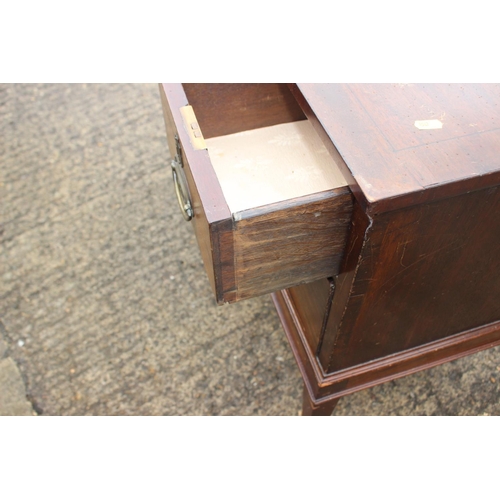 466 - A 19th century mahogany chest of three small and one long drawer with oval ring handles, on square t... 