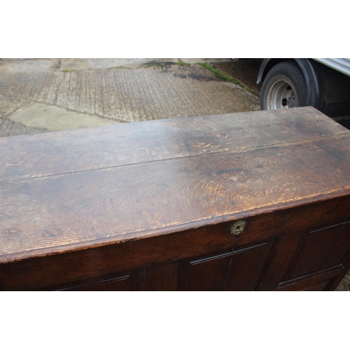 469 - An 18th century oak triple panel front mule chest, fitted two drawers, on stile supports, 53