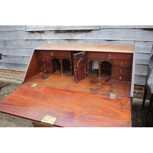 471 - A George III mahogany fall front bureau with interior fitted drawers, pigeonholes and secret compart... 