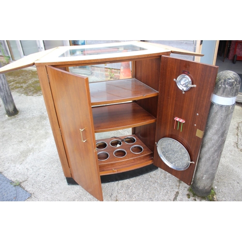 499 - A 1950s Turnidge walnut bowfront cocktail cabinet with fitted interior and tray top, 32