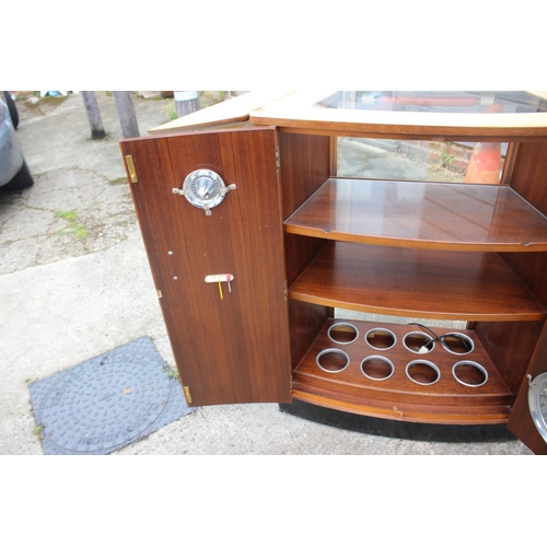 499 - A 1950s Turnidge walnut bowfront cocktail cabinet with fitted interior and tray top, 32