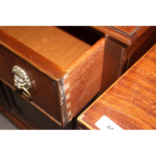 504 - A walnut bookcase of Georgian design, the upper section enclosed lattice glazed doors over two drawe... 