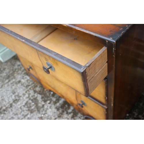 509 - A 1930s walnut chest of three long drawers, on block base, 34