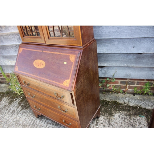 559 - An Edwardian mahogany and inlaid bureau bookcase, the upper section enclosed lattice glazed doors ov... 