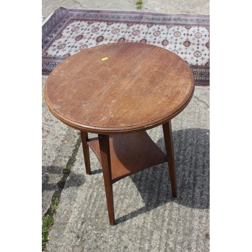 575 - A polished as walnut circular two-tier oak table, on cabriole supports, 25