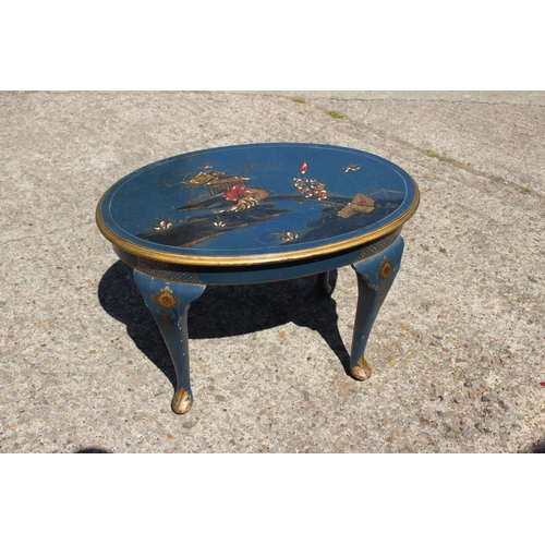 586 - An early 20th century chinoiserie lacquered oval occasional table, on cabriole supports, 23 1/2