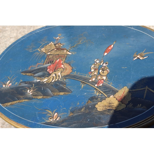 586 - An early 20th century chinoiserie lacquered oval occasional table, on cabriole supports, 23 1/2