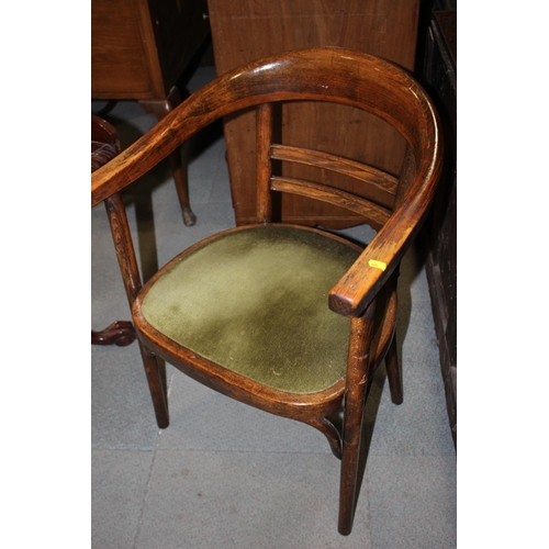 590 - A 1930s bentwood elbow chair with circular seat, upholstered in a green velour