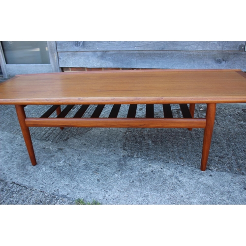 605 - A Glostrup Mobelfabkik Denmark  1960s teak ‘Surfboard’ coffee table with slatted undertier, on turne... 